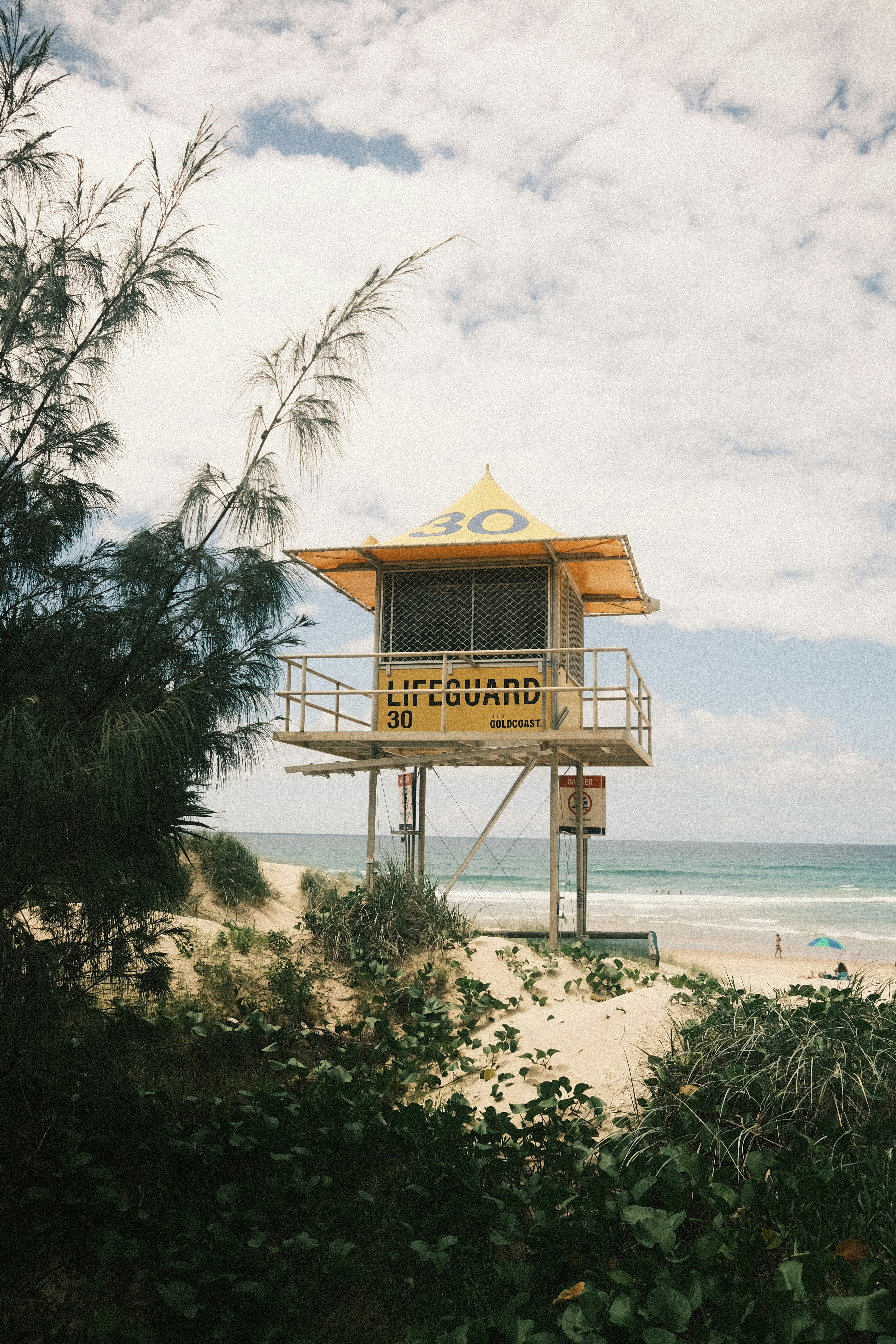 brown wooden house on beach during daytime